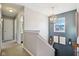 Upstairs hallway with neutral decor and a window, leading to bedrooms at 1655 Arbor Springs Dr, Brownsburg, IN 46112