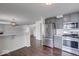 Modern kitchen with gray cabinets, stainless steel appliances, and marble countertops at 1715 Danielle Rd, Lebanon, IN 46052