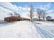 Brick ranch house with snow-covered yard and outbuildings at 18333 N State Road 9, Summitville, IN 46070