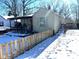 Cozy house with covered porch and snow-covered front yard at 2009 Calhoun St, Indianapolis, IN 46203