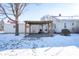 Cozy patio with pergola and seating area in winter at 202 Noble St, Greenwood, IN 46142