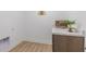 Bright laundry room with modern wood cabinets and marble countertop at 222 Ambassador Dr, Pittsboro, IN 46167