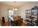 Charming dining room with wood table and built-in shelving at 2367 Heartland Ln, Brownsburg, IN 46112