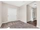Simple bedroom with carpeted floors and white doors at 250 Ambassador Dr, Pittsboro, IN 46167