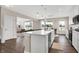 Modern kitchen with white cabinets, island, and stainless steel appliances at 250 Ambassador Dr, Pittsboro, IN 46167