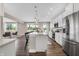 Modern kitchen with white cabinets, island, and stainless steel appliances at 250 Ambassador Dr, Pittsboro, IN 46167
