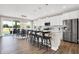 Modern kitchen with white cabinets, island, and stainless steel appliances at 250 Ambassador Dr, Pittsboro, IN 46167