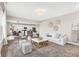 Open living room with a view into the kitchen and ample natural light at 250 Ambassador Dr, Pittsboro, IN 46167