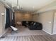 Spacious finished basement area with entertainment setup, comfortable seating, and stylish lighting at 251 Dyson Dr, Whiteland, IN 46184
