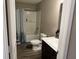 Bathroom featuring a shower-tub, a toilet, a sink and vinyl plank flooring at 251 Dyson Dr, Whiteland, IN 46184