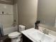 Bathroom with white vanity and sink next to a shower-tub at 251 Dyson Dr, Whiteland, IN 46184