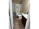 Bathroom featuring a shower-tub, a toilet, a sink and vinyl plank flooring at 251 Dyson Dr, Whiteland, IN 46184