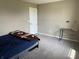 Bedroom with comfortable bed, neutral paint, and carpet flooring; simple and inviting space at 251 Dyson Dr, Whiteland, IN 46184