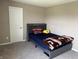 Bedroom with neutral paint, carpet flooring, and comfortable bed in a cozy space at 251 Dyson Dr, Whiteland, IN 46184