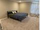 Bedroom with neutral walls, carpet, queen bed, and decorative curtains at 251 Dyson Dr, Whiteland, IN 46184