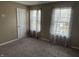 Bright bedroom with carpet, natural light, and two large windows at 251 Dyson Dr, Whiteland, IN 46184