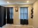 Bedroom with carpeted floor and light brown walls, and dark curtains on multiple windows at 251 Dyson Dr, Whiteland, IN 46184