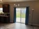 Bright dining area features sliding glass doors to the backyard with views of the lawn and neighborhood at 251 Dyson Dr, Whiteland, IN 46184