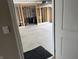 An open garage door reveals the unfinished garage interior at 251 Dyson Dr, Whiteland, IN 46184