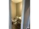 Small half bathroom with a toilet and pedestal sink at 251 Dyson Dr, Whiteland, IN 46184