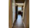 Hallway that leads to the kitchen and features gray wood flooring at 251 Dyson Dr, Whiteland, IN 46184