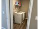 Laundry room with washer, dryer, shelving, and vinyl plank flooring at 251 Dyson Dr, Whiteland, IN 46184