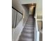 Carpeted staircase featuring white railings and natural light at 251 Dyson Dr, Whiteland, IN 46184
