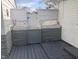 Small backyard with deck and gray stone wall at 2610 W 18Th St, Anderson, IN 46011