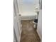 Bathroom with brown tile flooring and a bathtub at 2610 W 18Th St, Anderson, IN 46011