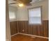 Bedroom with hardwood floors and wood-look walls at 2610 W 18Th St, Anderson, IN 46011