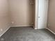 Simple bedroom with grey carpeting and neutral walls at 2610 W 18Th St, Anderson, IN 46011