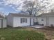 White detached garage with gray shutters and a deck at 2610 W 18Th St, Anderson, IN 46011