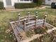 Landscaped front yard with a charming bridge at 2610 W 18Th St, Anderson, IN 46011