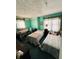 Bedroom with two beds and teal walls at 2615 Baltimore Ave, Indianapolis, IN 46218