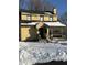 Yellow house exterior with snow on ground at 2615 Baltimore Ave, Indianapolis, IN 46218
