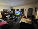 Living room with TV and comfy seating at 2615 Baltimore Ave, Indianapolis, IN 46218
