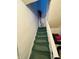 Green carpeted staircase with white railing at 2615 Baltimore Ave, Indianapolis, IN 46218