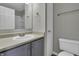 Small bathroom with gray vanity, toilet, and shower at 297 Van Buren St, Greenfield, IN 46140