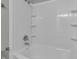 Clean bathroom with white subway tile and a bathtub at 297 Van Buren St, Greenfield, IN 46140