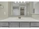 Bathroom with gray vanity, a white countertop, and a large mirror at 297 Van Buren St, Greenfield, IN 46140