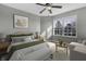 Bright bedroom with large window, offering ample natural light and a cozy sitting area at 297 Van Buren St, Greenfield, IN 46140
