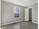 Spacious bedroom with grey walls and wood-look flooring at 297 Van Buren St, Greenfield, IN 46140