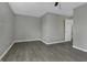 Simple bedroom with gray walls and gray laminate flooring at 297 Van Buren St, Greenfield, IN 46140