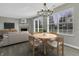 Cozy dining area with a wooden table and chairs, near a fireplace and kitchen at 297 Van Buren St, Greenfield, IN 46140