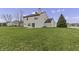 Back of the house showcasing a patio and spacious yard at 297 Van Buren St, Greenfield, IN 46140