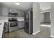 Modern kitchen with stainless steel appliances and gray cabinets at 297 Van Buren St, Greenfield, IN 46140