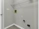 Laundry room with wire shelving and hookups for washer and dryer at 297 Van Buren St, Greenfield, IN 46140