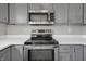 Stainless steel microwave installed above the stove at 297 Van Buren St, Greenfield, IN 46140