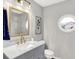 Updated bathroom with gray vanity, marble countertop, and gold fixtures at 3015 Olive Branch Rd, Greenwood, IN 46143
