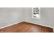 Simple bedroom with hardwood floors and window at 3015 Olive Branch Rd, Greenwood, IN 46143
